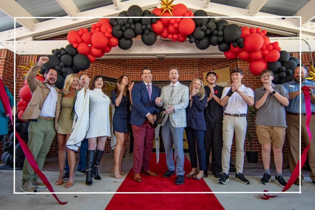 Group of people celebrating at NOLA Detox grand opening event.