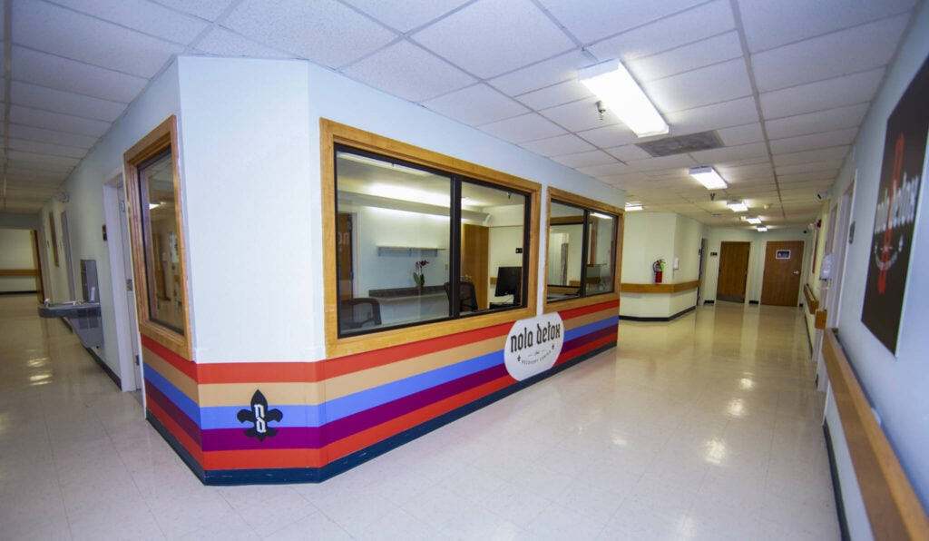 Interior view of NOLA Detox center with reception area and windows.
