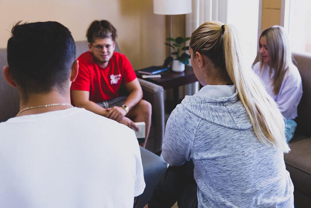 Group of young adults in a support group session at NOLA Detox.