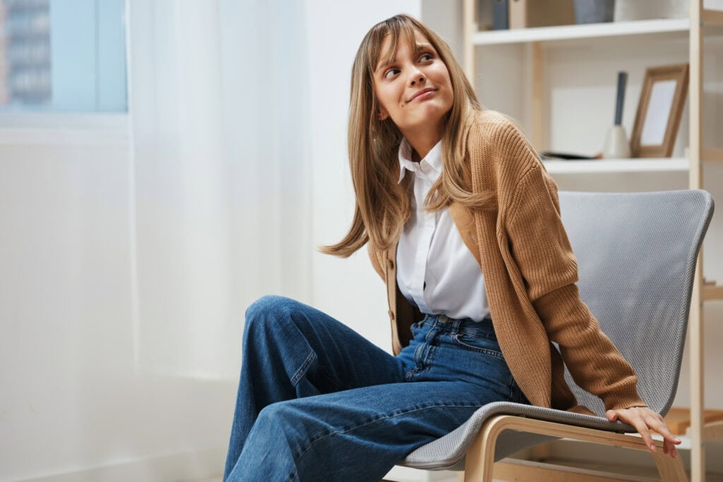 Young woman experiencing anxiety or depression in a therapy session.