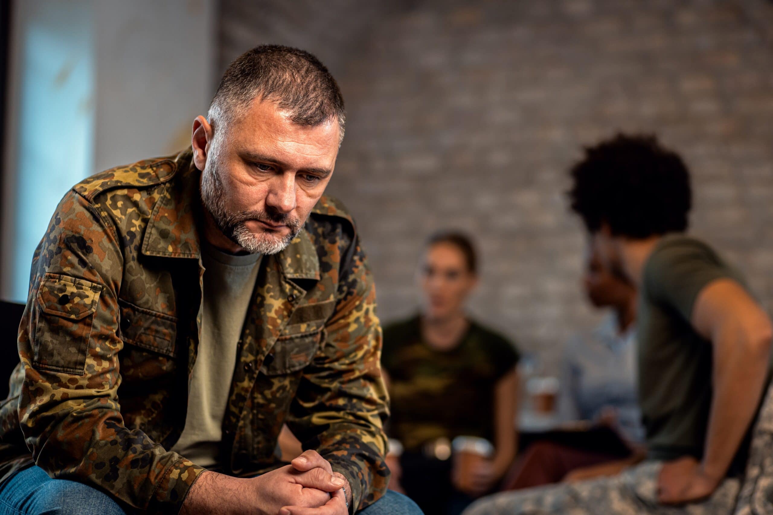 Man struggling with ptsd new orleans attending group.
