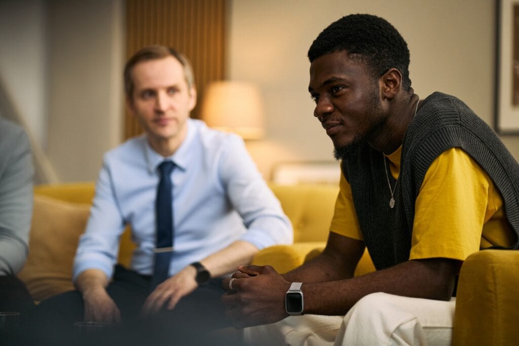 Young man talking in group after attending trauma therapy new orleans.