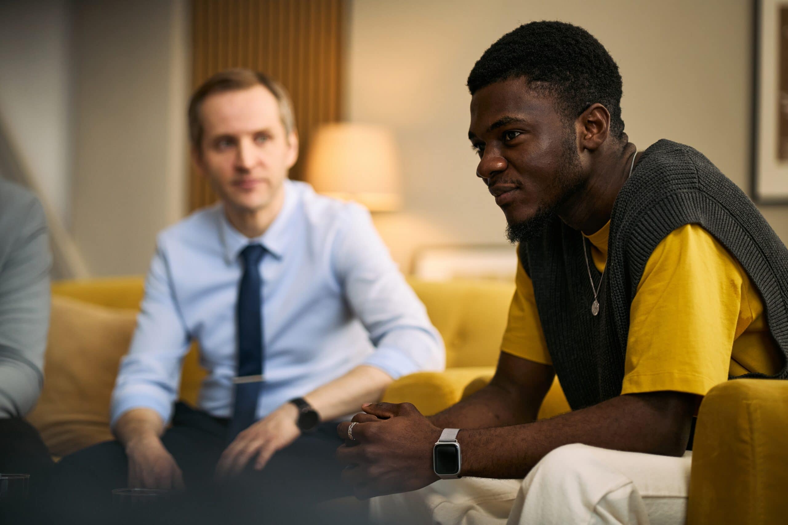 Young man talking in group after attending trauma therapy new orleans.